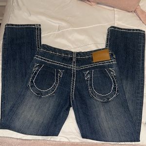 Dark blue slightly faded true religion jeans